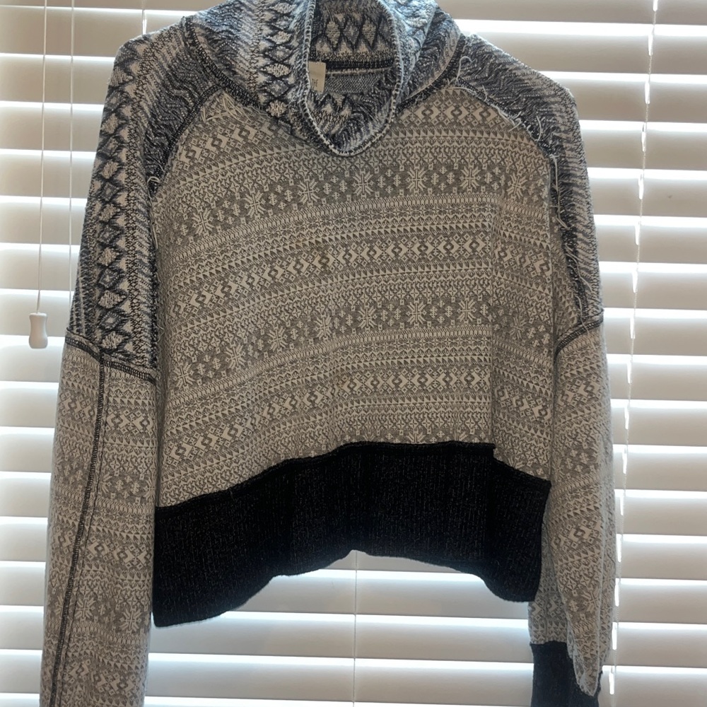 Free people sweater with a blue, black, and white pattern
